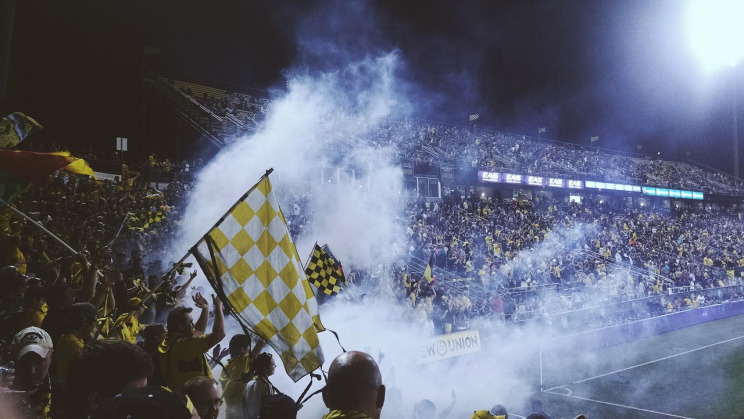 Southeast Asia sportsbook fans cheering at a football stadium on UFA Online ASEAN