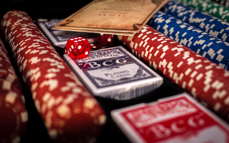 Live casino dealer table with playing cards and chips at UFA Online ASEAN